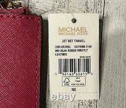 Michael Kors Jet Set Medium Saffiano Leather Crossover Wristlet In Carmine Pink